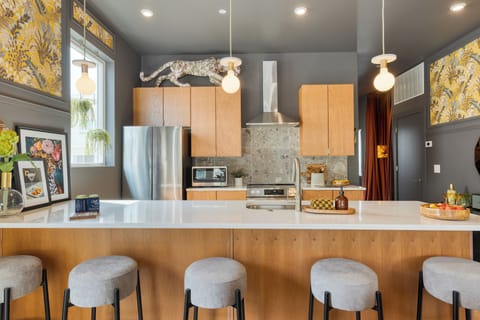Unit 101 Modern kitchen with barstool seating for dining
