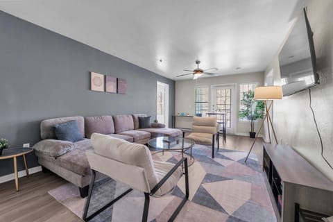 Bright living room w/ cozy sectional seating & open layout for easy gathering.