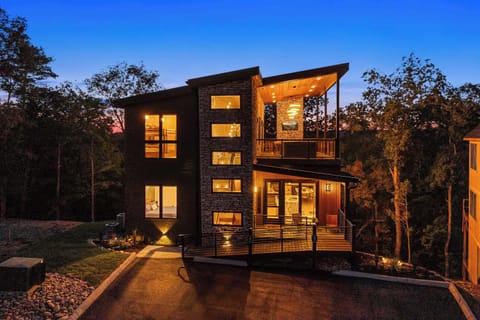 Stunning mountain escape with striking architecture and warm evening glow!