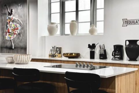 Gather ‘round the island for breakfast, cocktails, or good conversation – this kitchen was made for connection.”