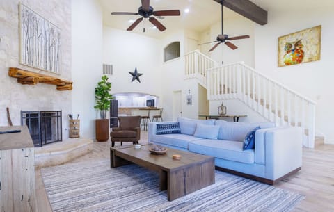 Relax in the open living area with plenty of seating and smart TV