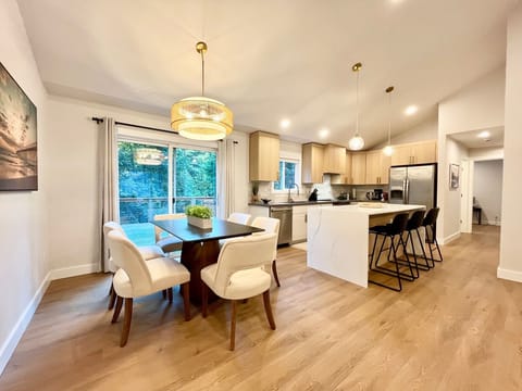 Another view of the dining area and kitchen