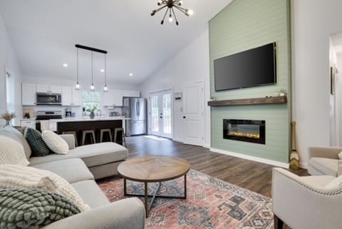 Living Room w/ Fireplace & TV