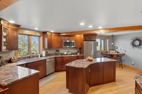 Gourmet kitchen with custom cabinetry and large center island.