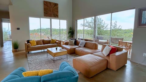 Living room with high ceiling windows and natural light