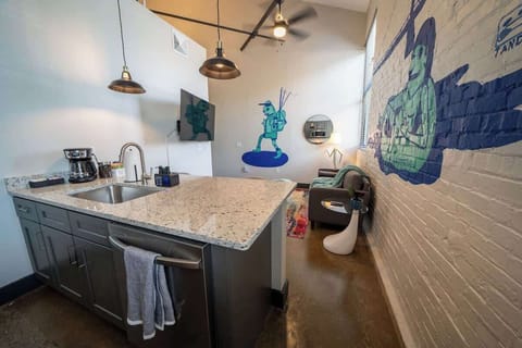 A practical fixture for washing dishes and preparing food, equipped with a faucet and ample space for convenience.