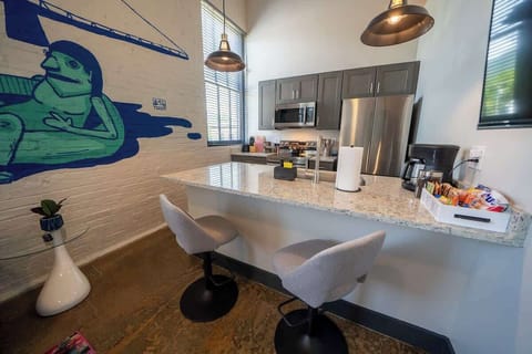 A space designed for enjoying meals, featuring a table and seating for comfortable dining and socializing.