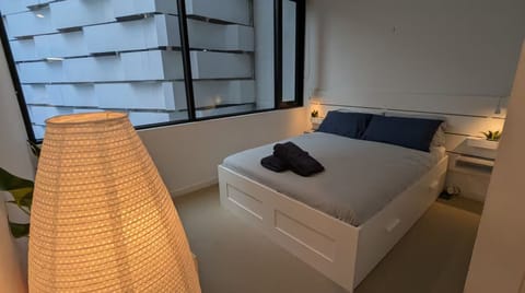 Comfortable queen bed, with individual reading lights and blackout blinds