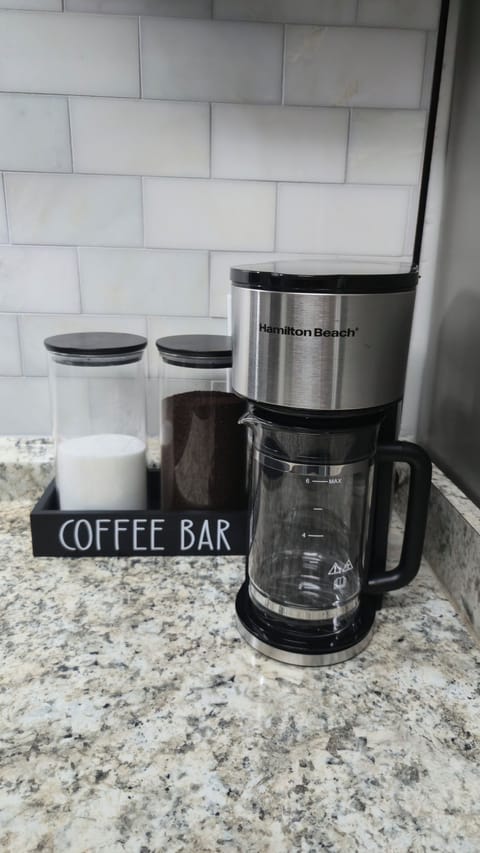 coffee maker with coffee and sugar
