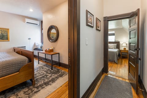 View of bedroom 5 and 6 via their shared private hallway (the two rooms share a bathroom via this private hallway)