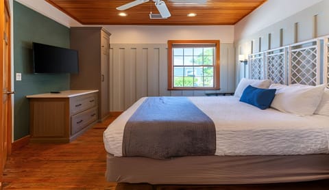 Recharge in a sunlit king bedroom with serene coastal style.