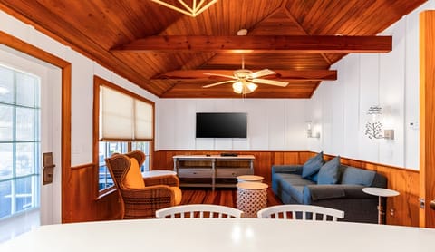 Gather under vaulted wood beams for cozy movie nights.