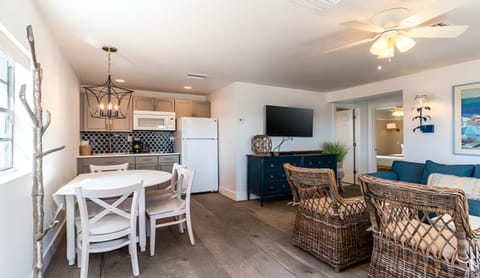Gather for meals and movies in an airy, open-concept space.