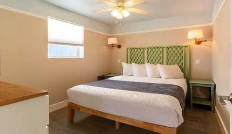 Unwind into crisp linens and a cozy, coastal king bed.
