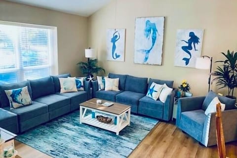 Spacious living room with plenty of seating—ideal for family time, movie nights,