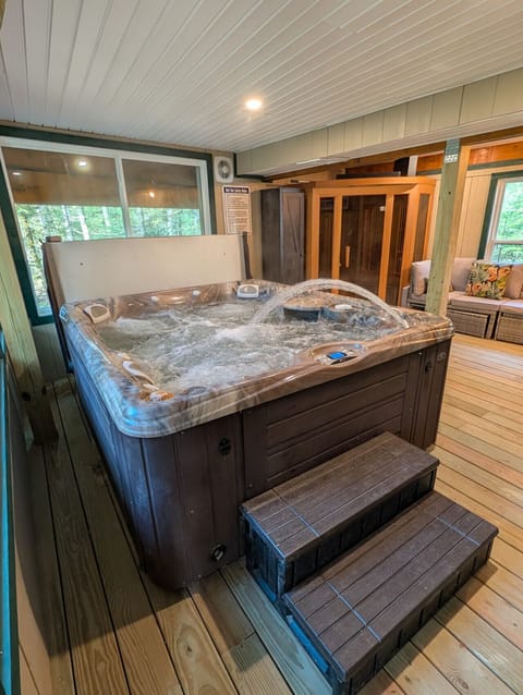 Enjoy the Forest View from the one-of-a-kind enclosed patio with Hot-tub and Sauna