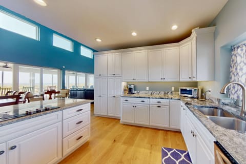 The bright kitchen has plenty of counter space to make great meals