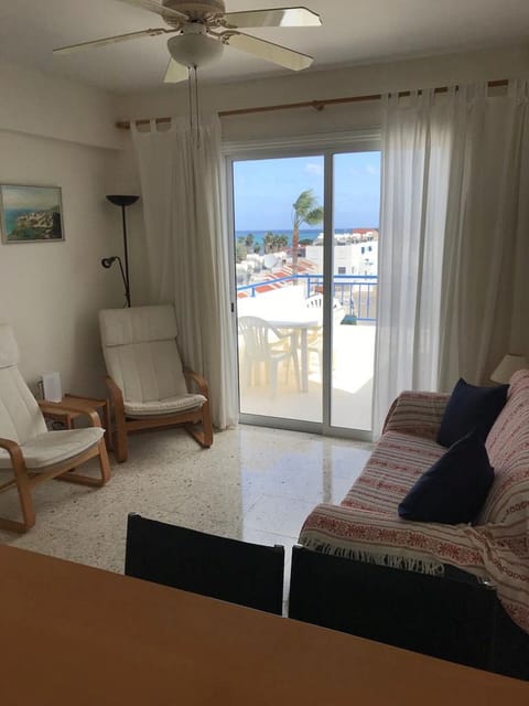 Living area with sofa and two armchairs