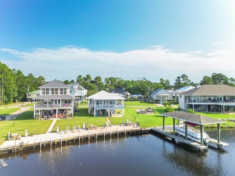 This charming area features multiple outdoor lounges, ideal for gathering with family and friends by the water.