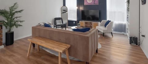 Unwind in this cozy, stylish living area with modern décor—perfect for relaxing after a day of exploring. Watch a movie on the flat-screen TV or enjoy conversation with friends on the comfortable sofa.