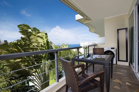 Balcony with pool and sea views