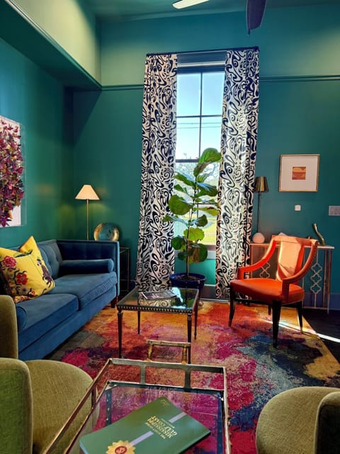 Spacious living room with 12-ft ceilings and abundant natural light.