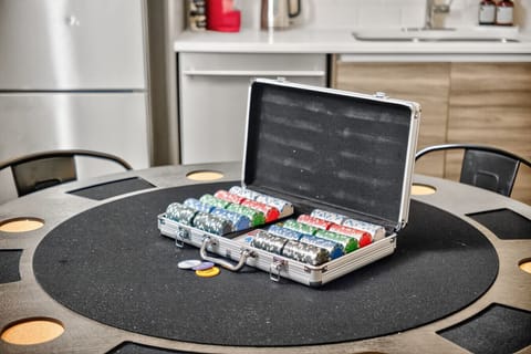 Dedicated poker setup with chips and card table — a strong feature for group stays.