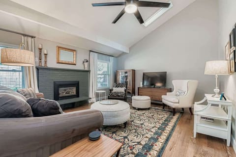 Relax and entertain in a large, open living room filled with natural light and plenty of comfortable seating.