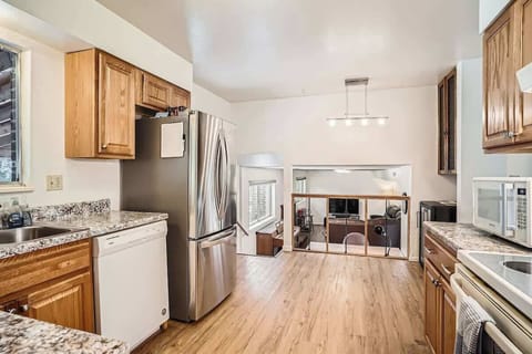 Cook and socialize in a kitchen that opens to the living room, making it easy to stay connected while preparing meals.
