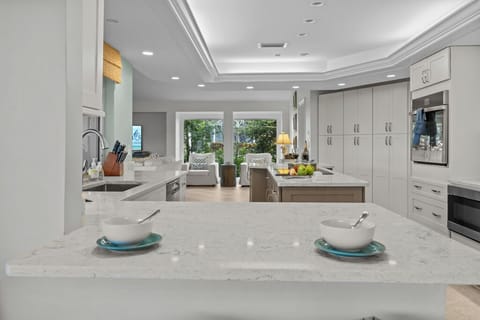 A chef's dream—this modern kitchen blends sleek design with everyday functionality for effortless entertaining.
