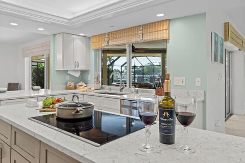 A chef's dream—this modern kitchen blends sleek design with everyday functionality for effortless entertaining.