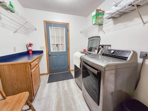 The laundry/mud room is the entrance to the home from the garage. Mega capacity washer and dryer are included.
