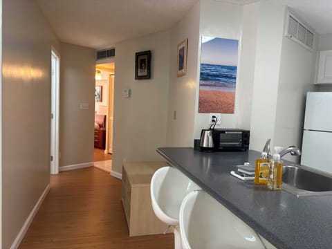 Long counter space for dining, wide hallway.