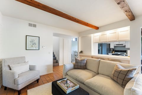 Main floor living room off of the kitchen with direct access to the back patio