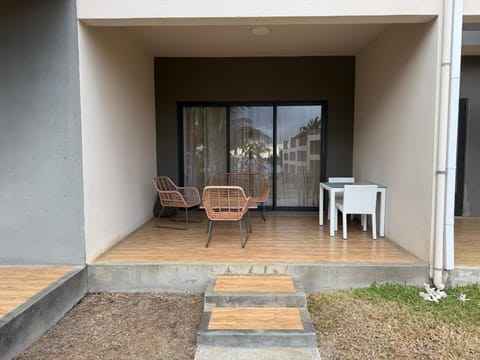 outside terrace leading to shared pool and outdoors space