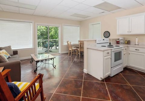 Relax after a lake day – cozy couch & plush accents.