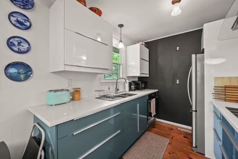 Sleek cabinetry and kitchen appliances for easy cooking.