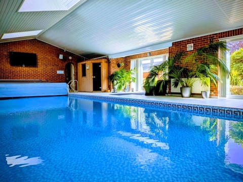12m x 5m heated pool, electric cover. Hot-tub. Sauna & Infrared Sauna. Zoned sound system.