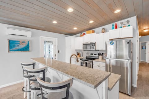 Kitchen island and extra dining area with stools