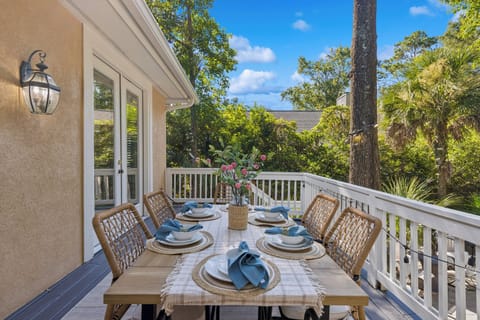 Relax on your private balcony with a dining table, perfect for enjoying a meal while overlooking the sparkling pool