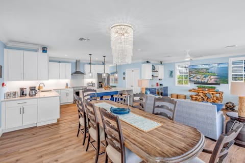 Enjoy family meals or group dinners in this spacious dining area at Emerald Shores, designed to maximize oceanfront views and natural light.