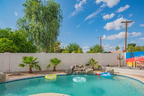 Float under blue skies in the spacious backyard pool with palm-lined privacy, your personal slice of Scottsdale resort living.