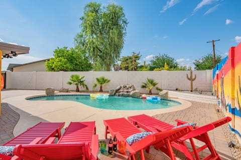 Lounge poolside in style with vibrant red sun chairs - perfect for soaking up the sunshine or sipping margaritas between swims.