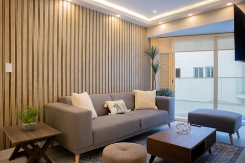 Elegant living room with gray sofa.