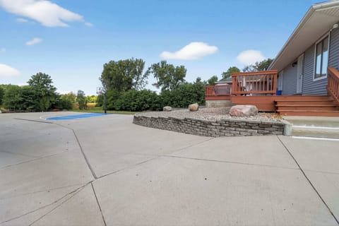 View of back deck and basketball court