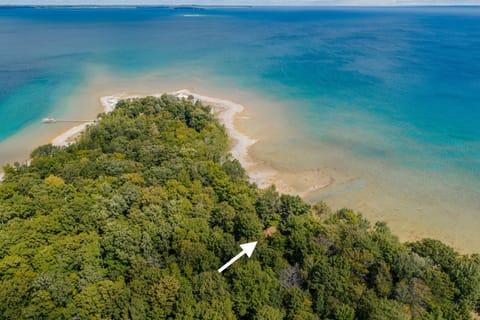 Aerial view of East Beach Cottage on the shores of Ingalls Bay, Omena