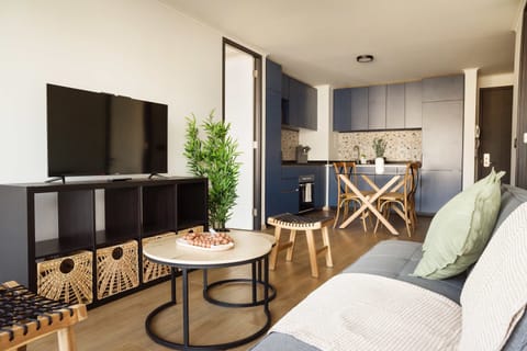 Relax in a stylish living area with modern decor and a cozy dining space, perfect for unwinding after a day of exploring.