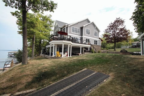 Enjoy the perfect lakefront retreat in this stunning multi-level home, featuring expansive decks, modern design, and direct access to the water.