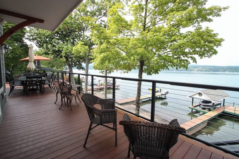 Unwind on the spacious lakeside deck, complete with cozy seating and panoramic water views—perfect for morning coffee or evening cocktails.