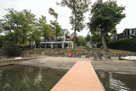 Enjoy direct access to the lake with a private sandy beach, dock, and spacious yard perfect for relaxing by the water.